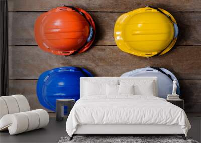 Yellow, Orange, White and Blue protective safety helmet Wall mural