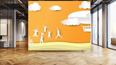 abstract orange sky and happy family and friends jumping with ballon airship for tourists of paper art style Wall mural