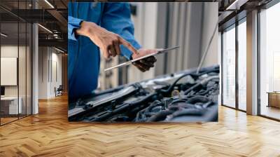 Automotive mechanic repairman using tablet to checking engine room, check the mileage of the car, oil change, car auto service, auto maintenance service concept. Wall mural