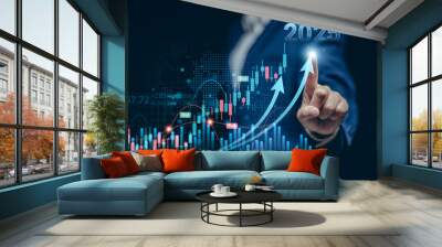 Businesswomen pointing to arrow up virtual to forecast and analyze the stock market and economic year 2025 with virtual chart,  trend upside business market growth, investments and financial concept. Wall mural