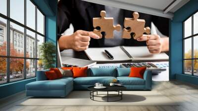 close up of businesswomen connecting couple puzzle wood jigsaw, teamwork, success, goals, strategy, partnership, business solution concept. Wall mural