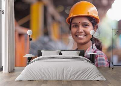 Female engineer worker, happy Asian working woman smiling in heavy industrial machinery factory Indian female engineer working with documents at prefabricated work site Wall mural