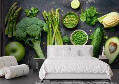 Healthy vegetarian food concept background, fresh green food selection for detox diet, raw broccoli, apple, cucumber, spinach, peas, asparagus, avocado,  Wall mural