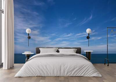 Clouds, blue sky, calm sea. And skyline Wall mural