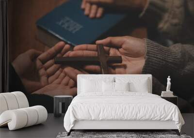 Christian group are praying to god with the bible and sharing the gospel. Concept of faith for god. Wall mural