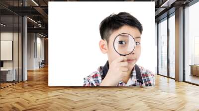 portrait of a young asian child looking through a magnifying gla Wall mural