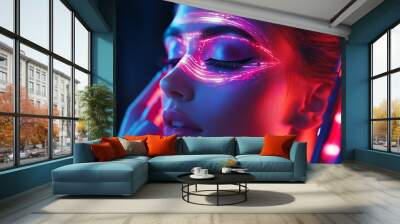 A close-up of a woman with neon makeup and glowing effects. Wall mural