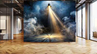 A bright spotlight cuts through a dark, hazy atmosphere, illuminating swirling tendrils of misty smoke that dance in the intense, golden-hued beam of light. Wall mural