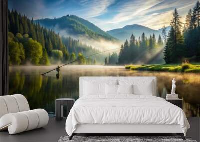 A serene morning scene featuring a lone fly fishing rod casting a line into a calm, misty lake surrounded by lush green forest and mountains. Wall mural