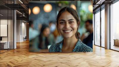 Close-up of a woman smiling and looking confident in a creative workspace, team collaborating in the background, inspiring work environment, Portrait half-body, hyper-realistic, high detail, Wall mural