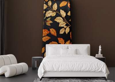 Stylish tie adorned with leaf patterns in warm autumn colors, perfect for adding a seasonal touch to formal attire. Wall mural