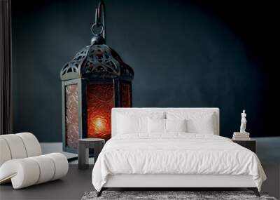 Design metal lantern with candle light and dark background Wall mural