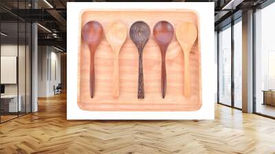 Wooden plate with  spoon isolated on white background Wall mural