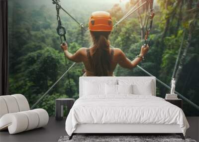 A woman wearing casual clothes on a zip line or canopy experience Wall mural