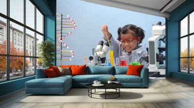 Asian girls on the way to success Science experiment in the laboratory Chemical research School biology lesson The little girl in the school lab Formal school education Little scientists. Wall mural