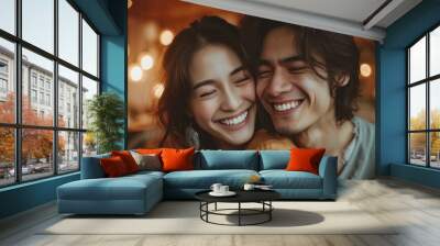 Asian young couple smile and laughing with positive emotion and loving together at warmth place. Wall mural