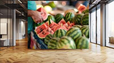 Customers pick fresh watermelons from a stall at a local market. Suitable for summer or nutrition concepts. Wall mural