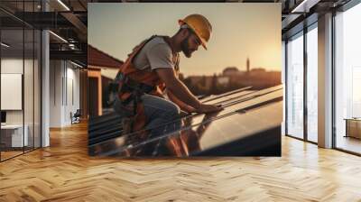 Engineers connecting cables while installing photovoltaic solar panels on roof of house. Wall mural