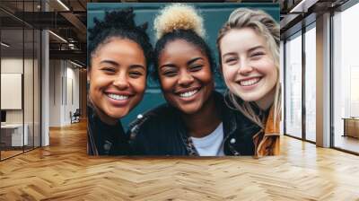 Friends smiling at the camera, showing the joy of friendship Wall mural