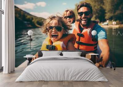 Happy family with two kids enjoying kayak ride on beautiful river. Wall mural