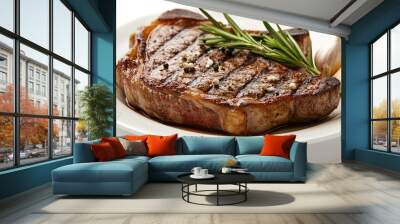 A steak with rosemary and garlic on top of a white plate. The steak is cooked and has a nice sear Wall mural