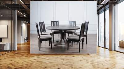 wood round table and chairs set on wood floor in white wall room Wall mural