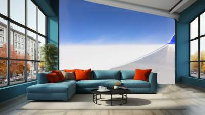 the sky when i am looking through window aircraft during flight in wing with a blue sky. Wall mural