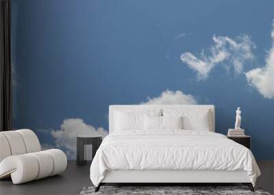 White clouds in a blue sky Wall mural