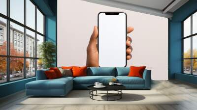 mock up a hand holding a smartphone with a blank screen. This image can be used for a variety of purposes, such as web design, graphic design, and digital marketing. Wall mural