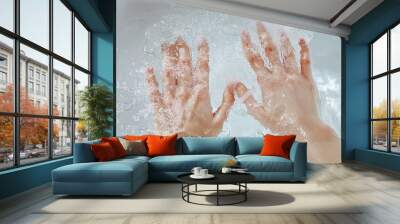 Two Hands Submerged in Water with Bubbles Wall mural