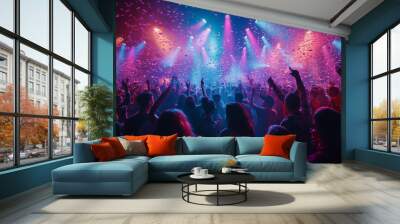 Vibrant Concert Crowd Celebrating with Confetti and Colorful Stage Lights Wall mural