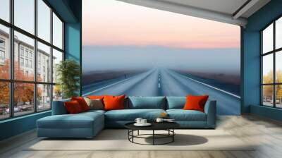 Empty highway stretching into a misty horizon at dawn, creating a sense of anticipation and mystery, Misty Highway, Morning Journey Wall mural