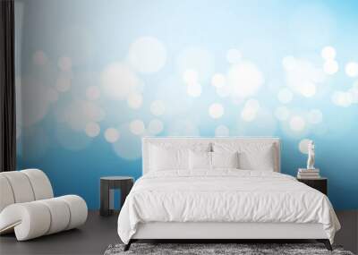 Blurred bright abstract bokeh on blue background Wall mural