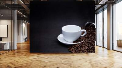 cup of coffee with beans and coffee machine on black background Wall mural