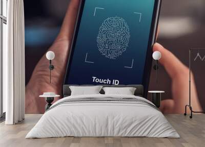 Close-up of hands scanning fingerprint on smartphone to unlock mobile phone on the table, Concept security in identity technology. Wall mural