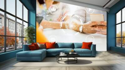 Concept technology internet and networking, friends group holding smartphone on the table with media icon on digital display. Wall mural