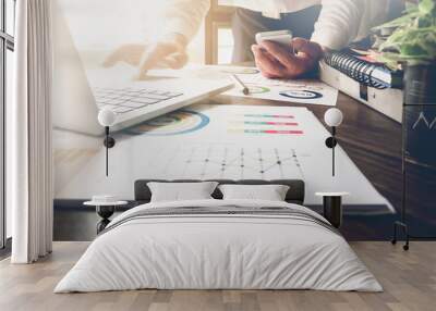 soft focus of businessman hand working laptop on wooden desk in office in morning light. vintage effect Wall mural