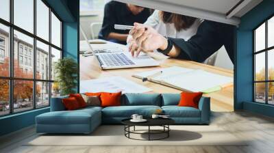 teamwork, Young businesswoman in office in casual shirt. Selecting information with colleagues with a computer. Business Marketing Planning. Wall mural