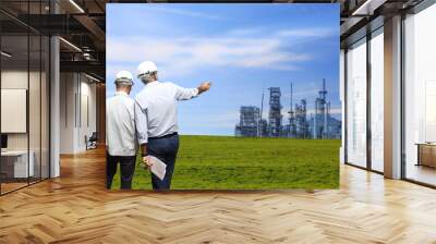 engineer and  agricultural landscape and buildings of chemist plant and blue sky Wall mural