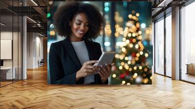 A businesswoman sending out holiday emails with a festive background, celebrating Christmas in a professional setting Wall mural