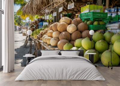 A display of fresh, market-ready coconuts (Cocos nucifera), perfect for tropical drinks and cooking Wall mural