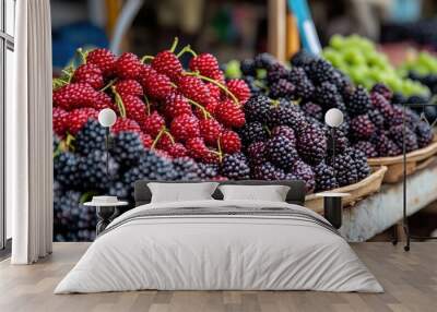 A display of freshly picked mulberries (Morus species), with their deep purple and red hues Wall mural