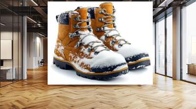 A pair of winter boots covered in snow, isolated on a white background, perfect for winter tourism Wall mural