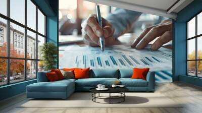 Businessman analyzing financial data and making notes Wall mural