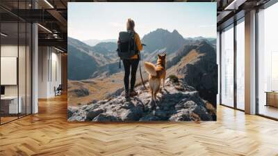 female mountain shooter Backpack travel woman with dog in towering mountain peak nature mountains trip Wall mural