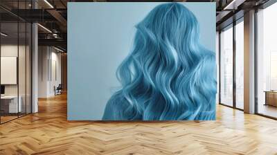 portrait of a beautiful long voluminous wavy blue hair on a girl, viewed from the back,Beautiful girl with hair coloring in ultra sky blue Stylish hairstyle done in a beauty salon. Fashion, cosmetics  Wall mural