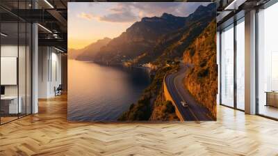 The dramatic coastal cliffs and winding roads of the Amalfi Coast, Italy, bathed in golden light Wall mural