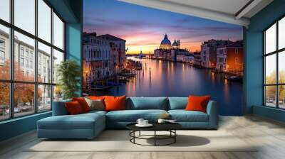 The picturesque canals and historic architecture of Venice, Italy, bathed in the soft light of dawn Wall mural