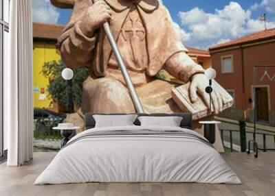 Sculpture of the Apostle Santiago as a pilgrim of the Camino de Santiago in Villar de Mazarife. Leon, Spain Wall mural