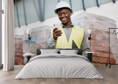 Architecture, phone and smile with black man on construction site for networking, communication and digital. Engineering, building and designer with male contractor in city for property and app Wall mural